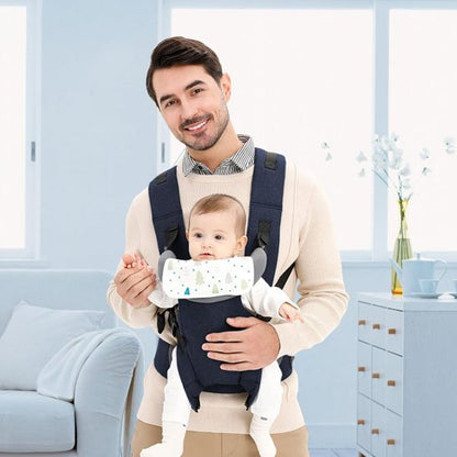 Papa promène bébé dans le porte-bébé physiologique face avant