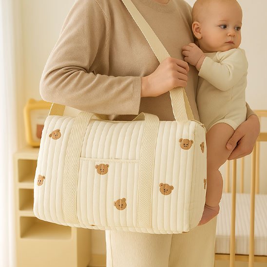 Sac a langer bebe transportable sur l'épaule avec bebe